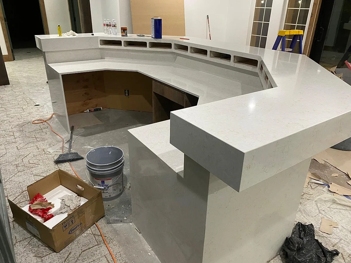 The reception desk with its island section in place before final finishing